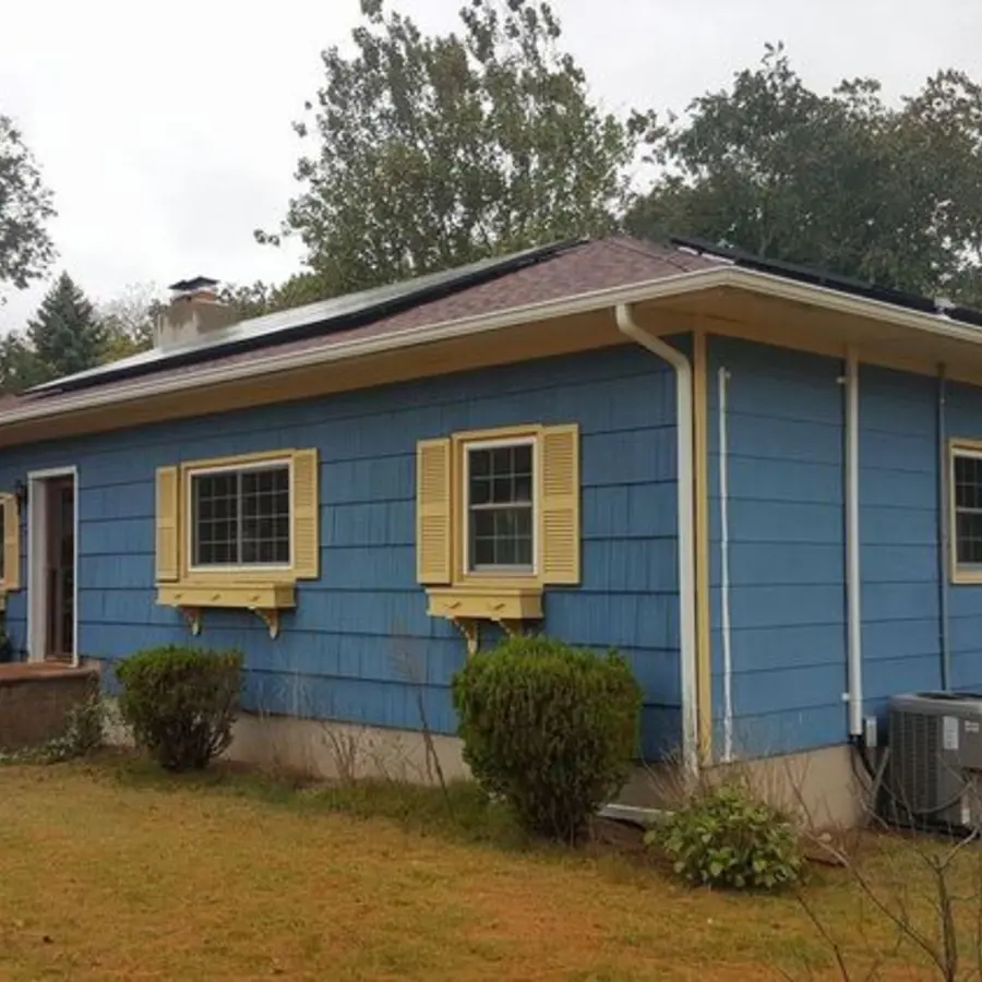 Older blue siding before replacement