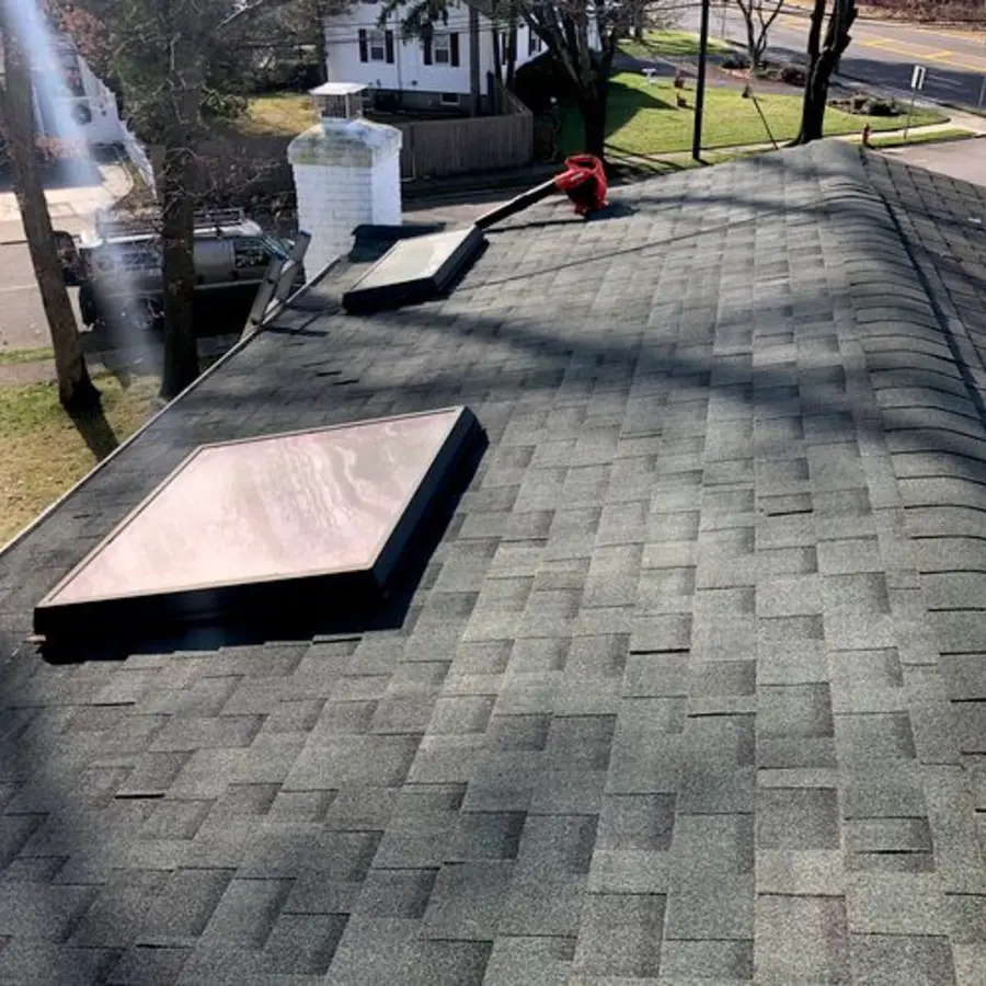 Completed shingle roof around skylights